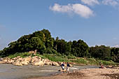 Luang Prabang, Laos - Walking along the riverfront of the Mekong. 